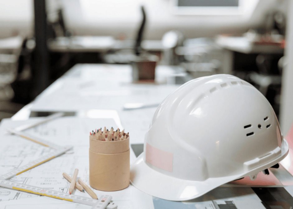 White Hard Hat Next to a Pen Holder